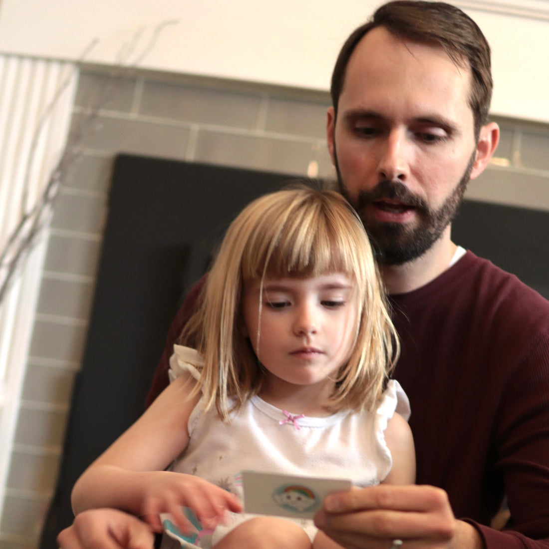 happy preschooler play the bedtime board game with mom and dad